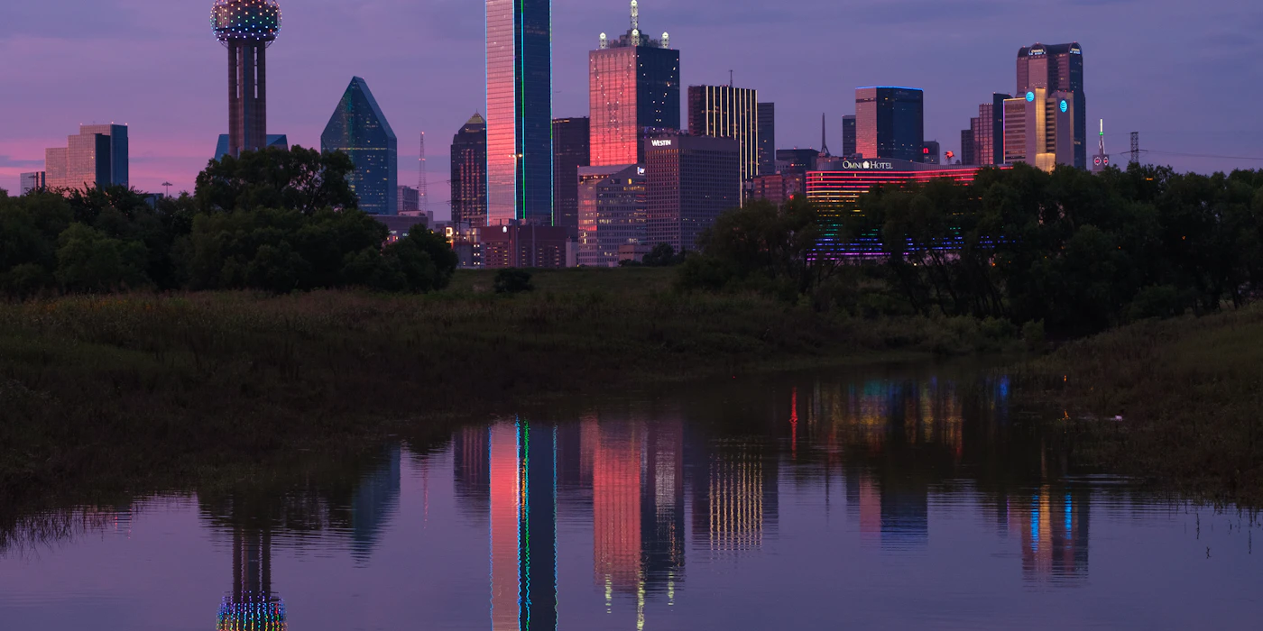 Dallas-Fort Worth skyline reflected in water representing local DFW vending service area