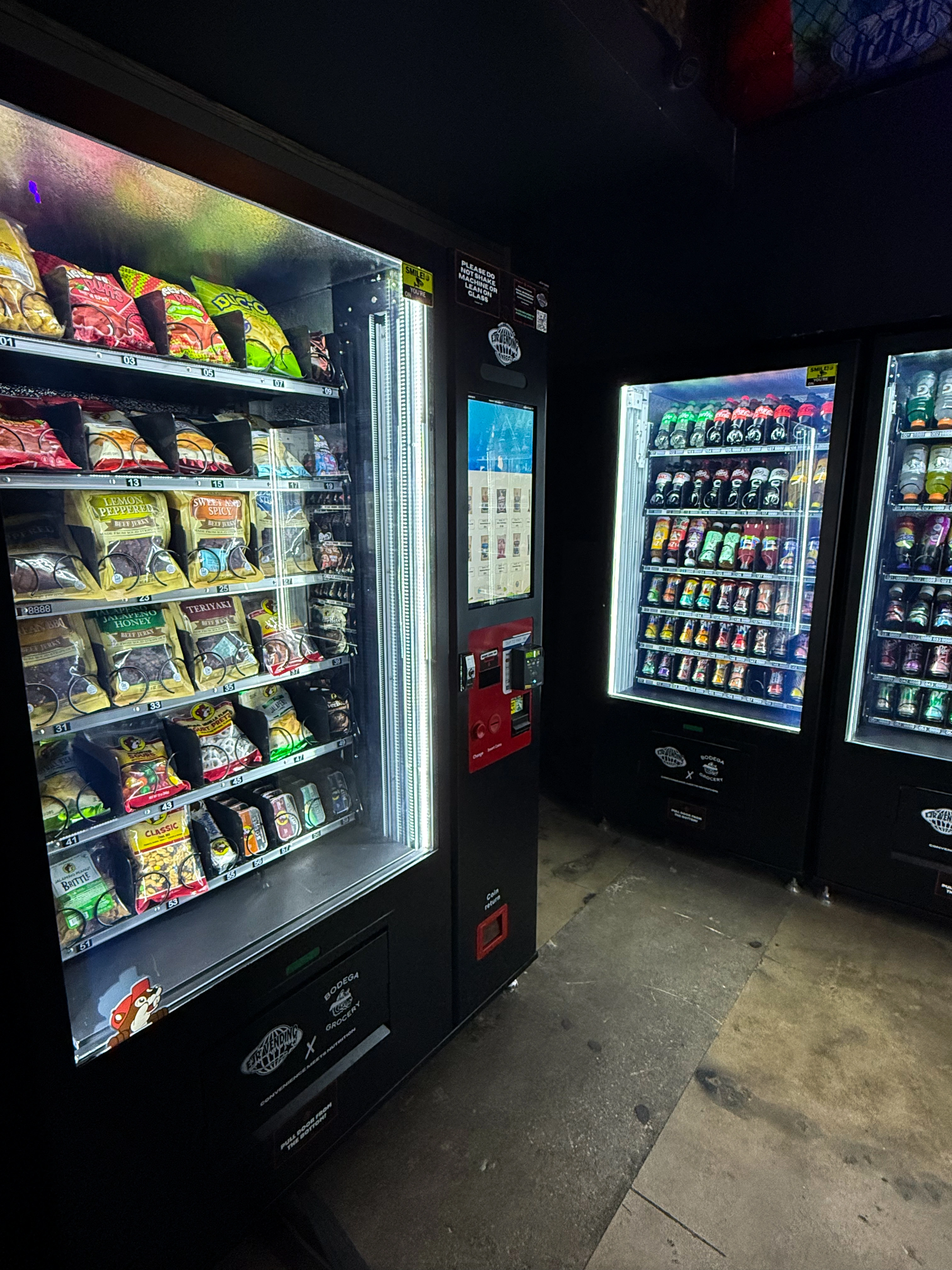 Touchscreen vending machines with snacks and drinks inside Bodega W. 7th Fort Worth