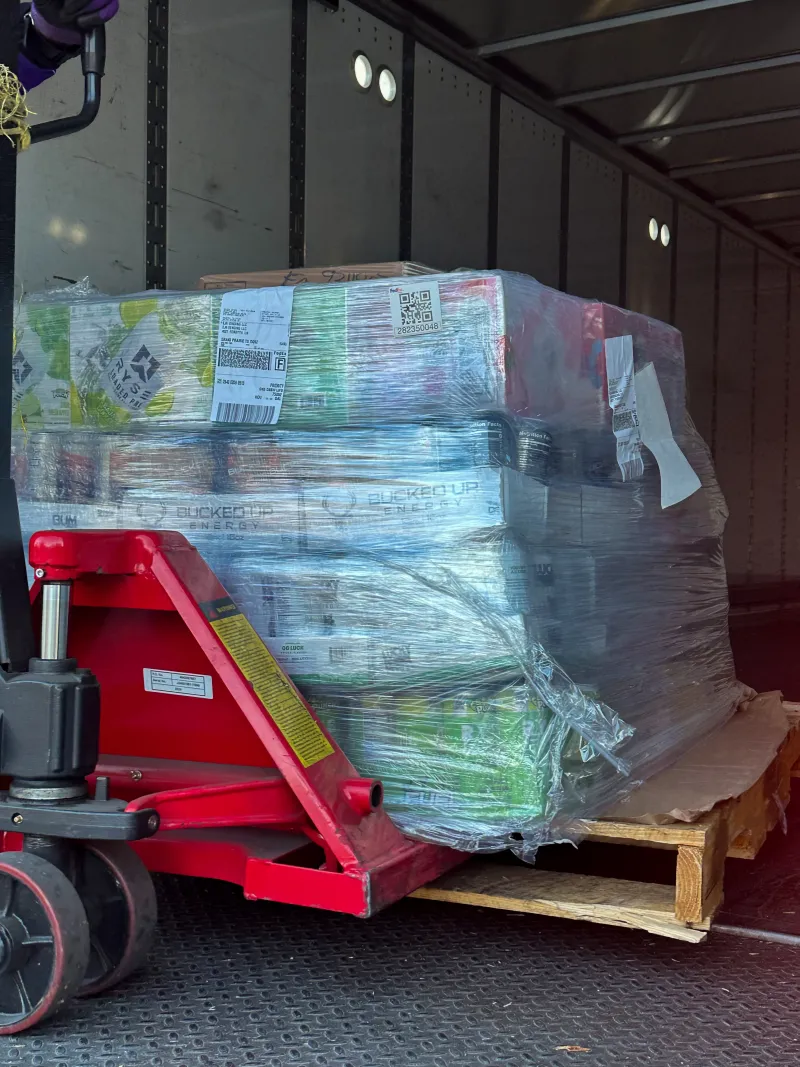 Pallet of vending machine inventory arriving at EJR Vending warehouse in DFW